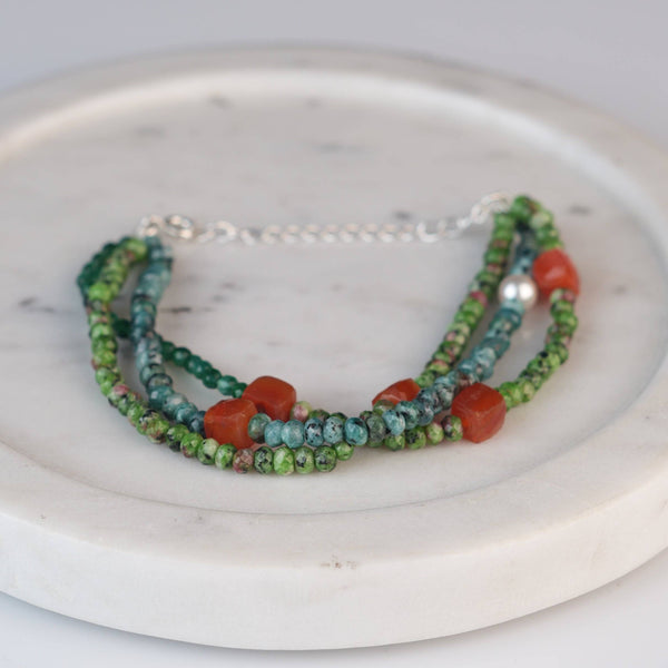 Close-up of Carnelian, Green Onyx, Green Jade & Blue Jade Silver Bracelet showcasing natural gemstones and intricate handmade silver craftsmanship