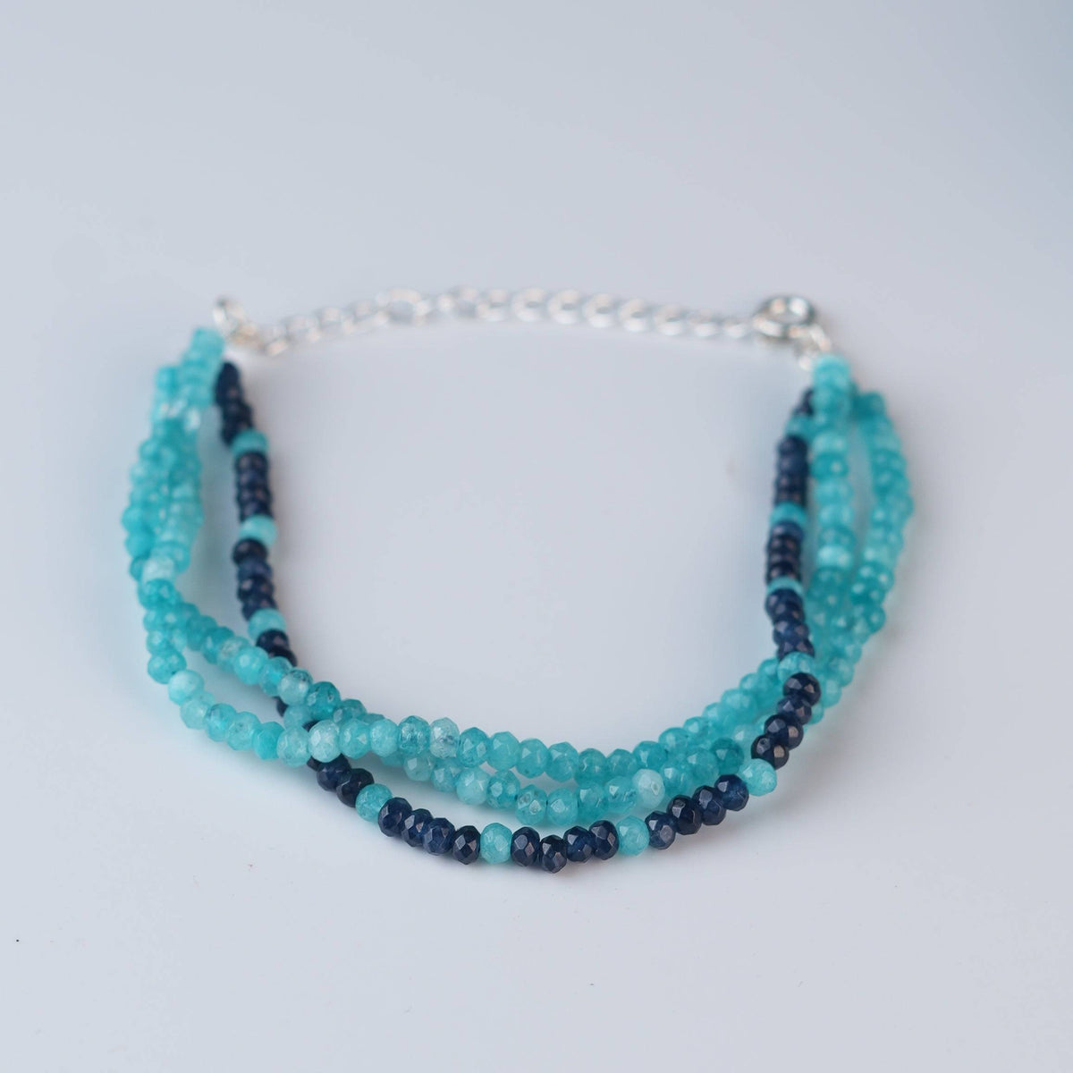 Close-up of Dark & Light Blue Jade Silver Bracelet showcasing dark and light blue jade stones with intricate handmade silver craftsmanship