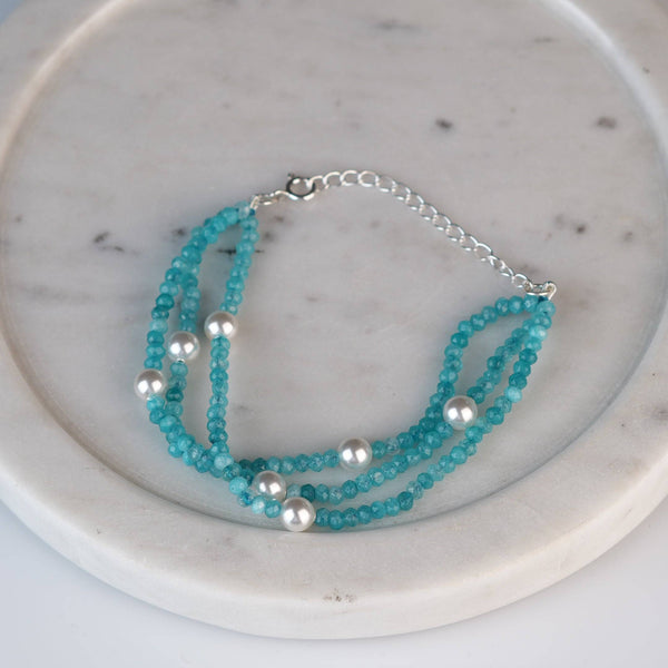 Angled view of Blue Jade & Pearl Silver Bracelet in 92.5 sterling silver with blue jade and pearl detailing
