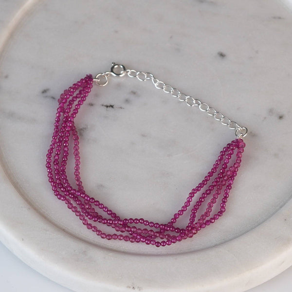 Close-up of a ruby silver bracelet showcasing ruby gemstones and intricate handmade silver craftsmanship