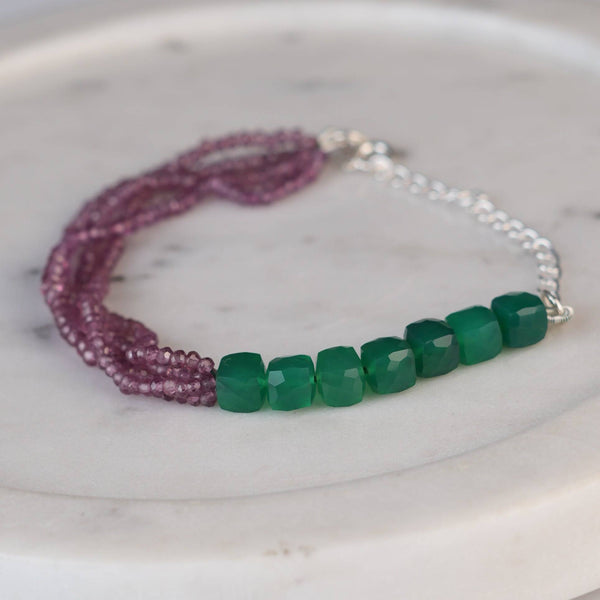 Angled view of Green Onyx & Rhodonite Silver Bracelet in 92.5 sterling silver with green onyx and rhodonite gemstone detailing