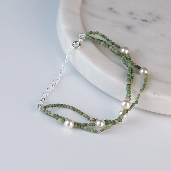 Angled view of Micro Firoza & Pearl Silver Bracelet in 92.5 sterling silver with firoza and pearl detailing