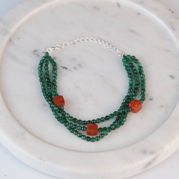 Angled view of Green Onyx & Carnelian Silver Bracelet in 92.5 sterling silver with green onyx and carnelian gemstone detailing