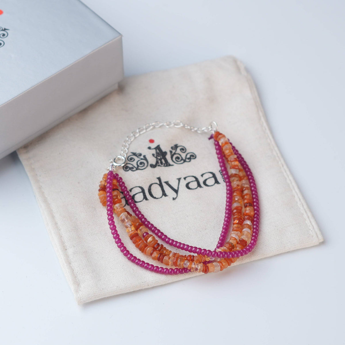 Detailed view of Ruby & Carnelian Silver Bracelet highlighting ruby accents, natural carnelian stones, handcrafted silverwork, and polished finish