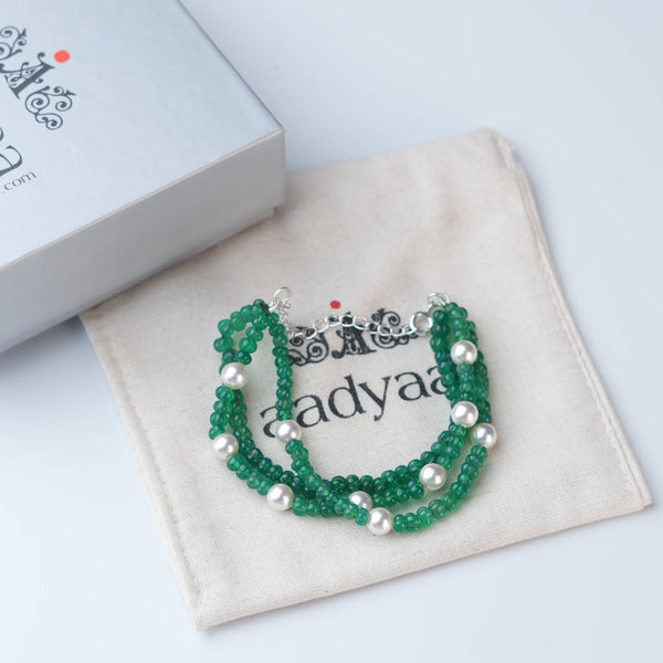 Detailed view of Green Onyx & Pearl Silver Bracelet highlighting natural green onyx stones, pearl accents, handcrafted silverwork, and polished finish