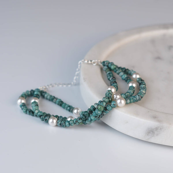 Angled view of Blue Jade & Pearl Silver Bracelet in 92.5 sterling silver with blue jade and pearl detailing