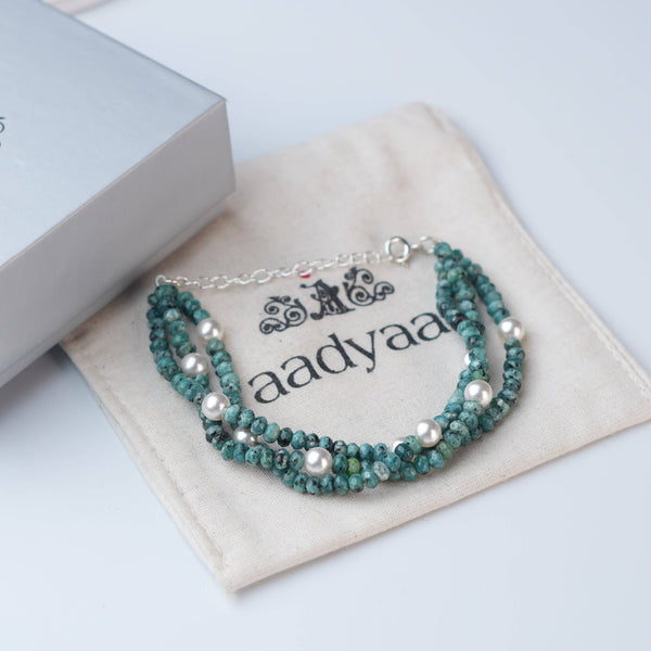 Detailed view of Blue Jade & Pearl Silver Bracelet highlighting natural blue jade stones, pearl accents, handcrafted silverwork, and polished finish