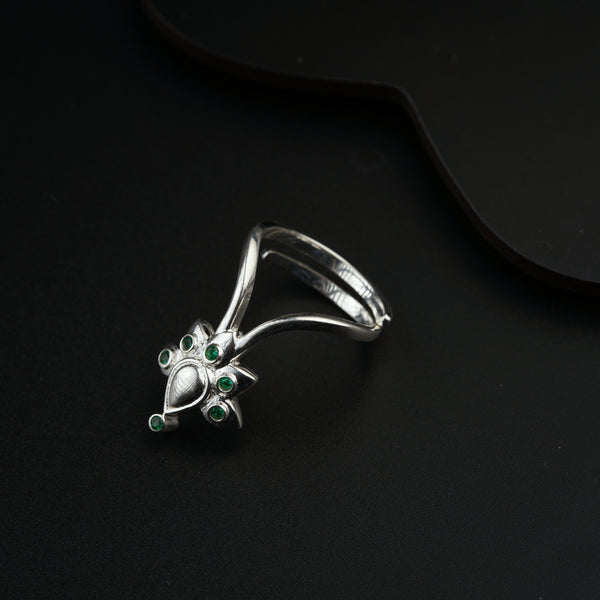 a close up of a ring on a black surface