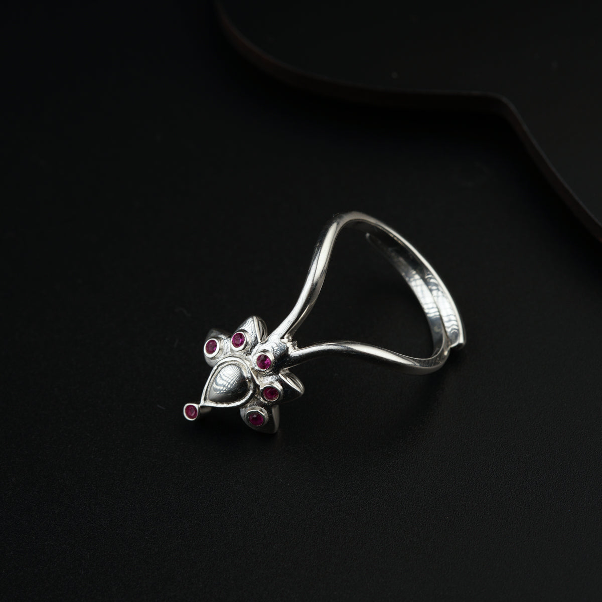 a close up of a ring on a black surface
