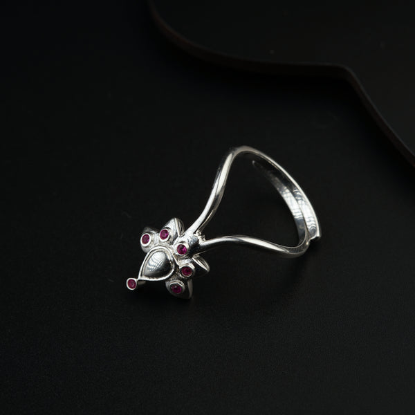 a close up of a ring on a black surface