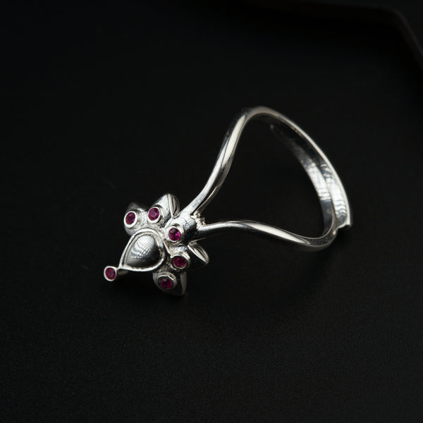 a close up of a ring on a black surface