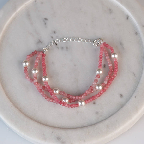 Angled view of Pink Jade & Pearl Silver Bracelet in 92.5 sterling silver with pink jade and pearl detailing