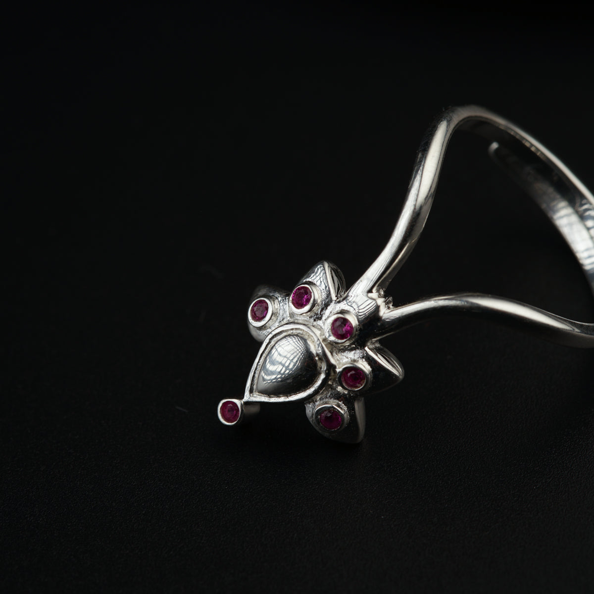a close up of a ring on a black surface