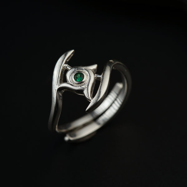 a close up of a ring on a black surface