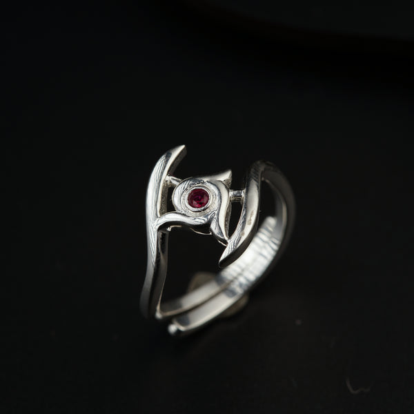 a close up of a ring on a black surface