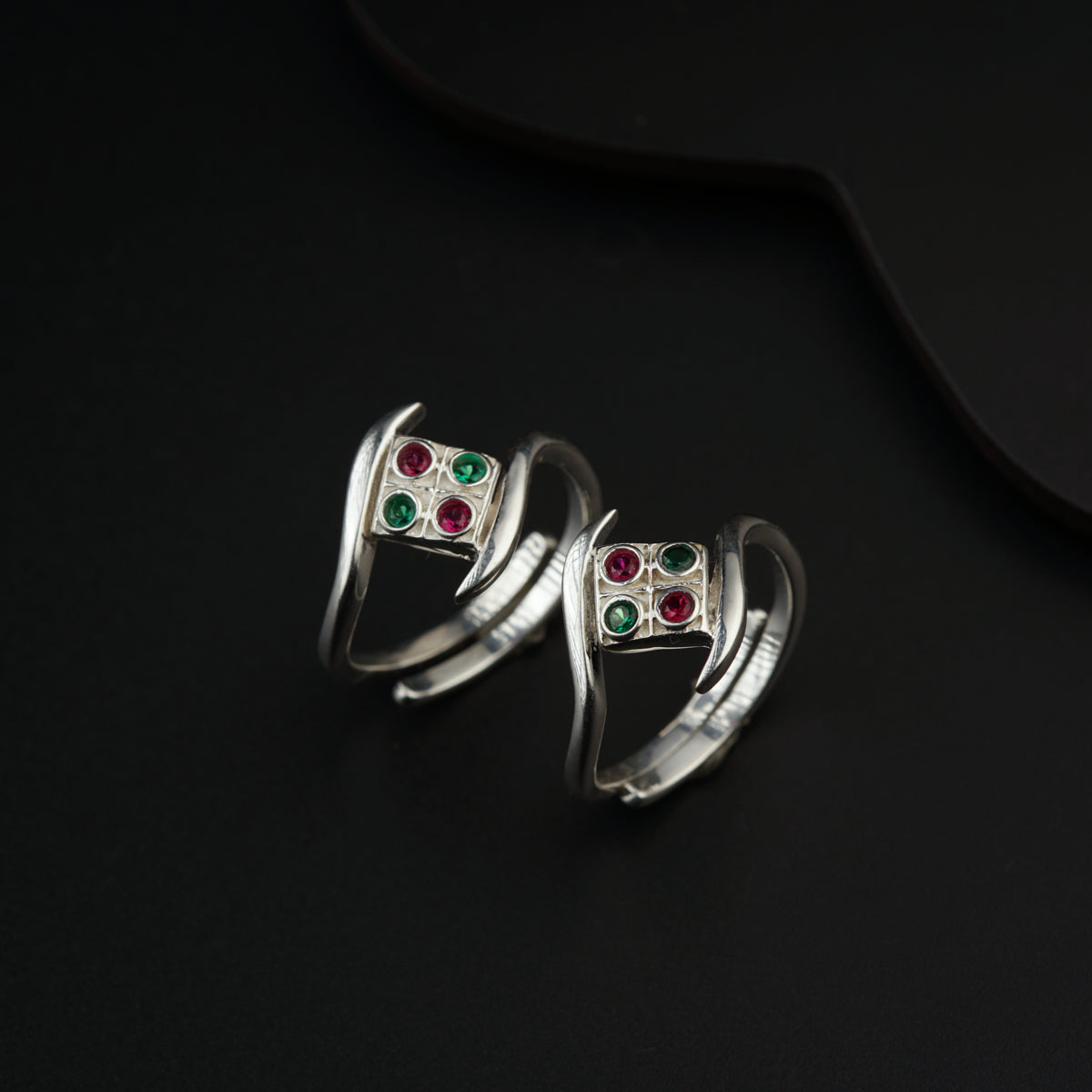 a pair of rings sitting on top of a table