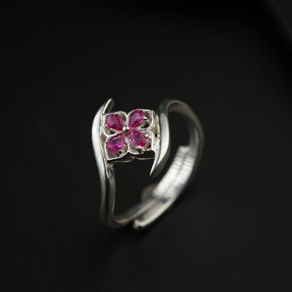 a close up of a ring on a black surface