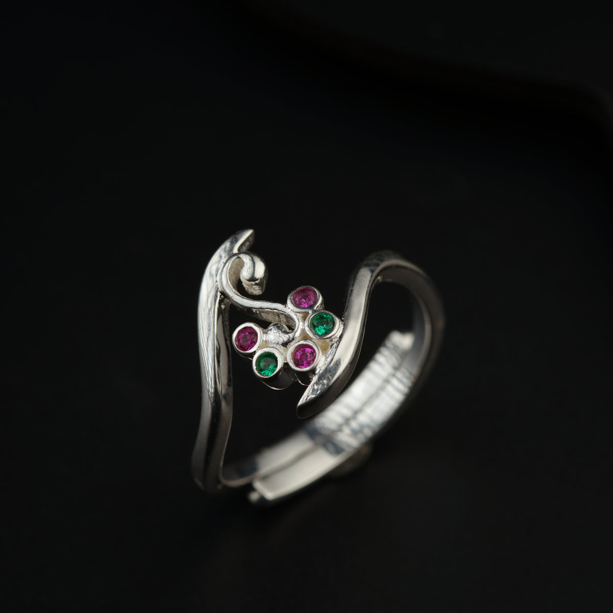 a close up of a ring on a black surface