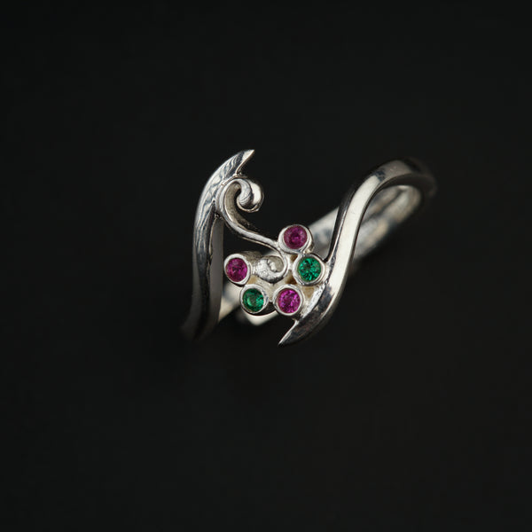 a close up of a ring on a black background