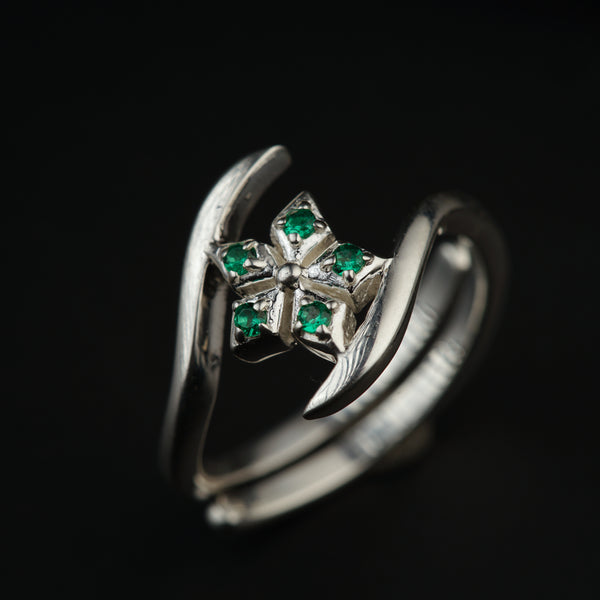 a close up of a ring on a black background