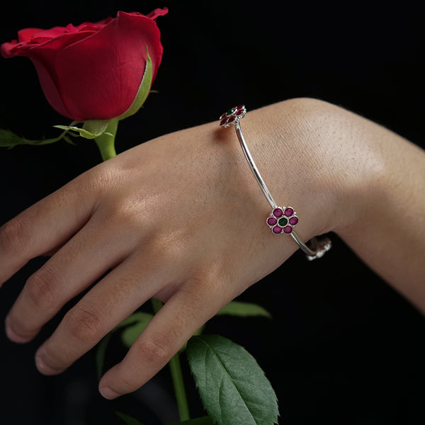 Silver floral bracelet with pink and green enamel accents