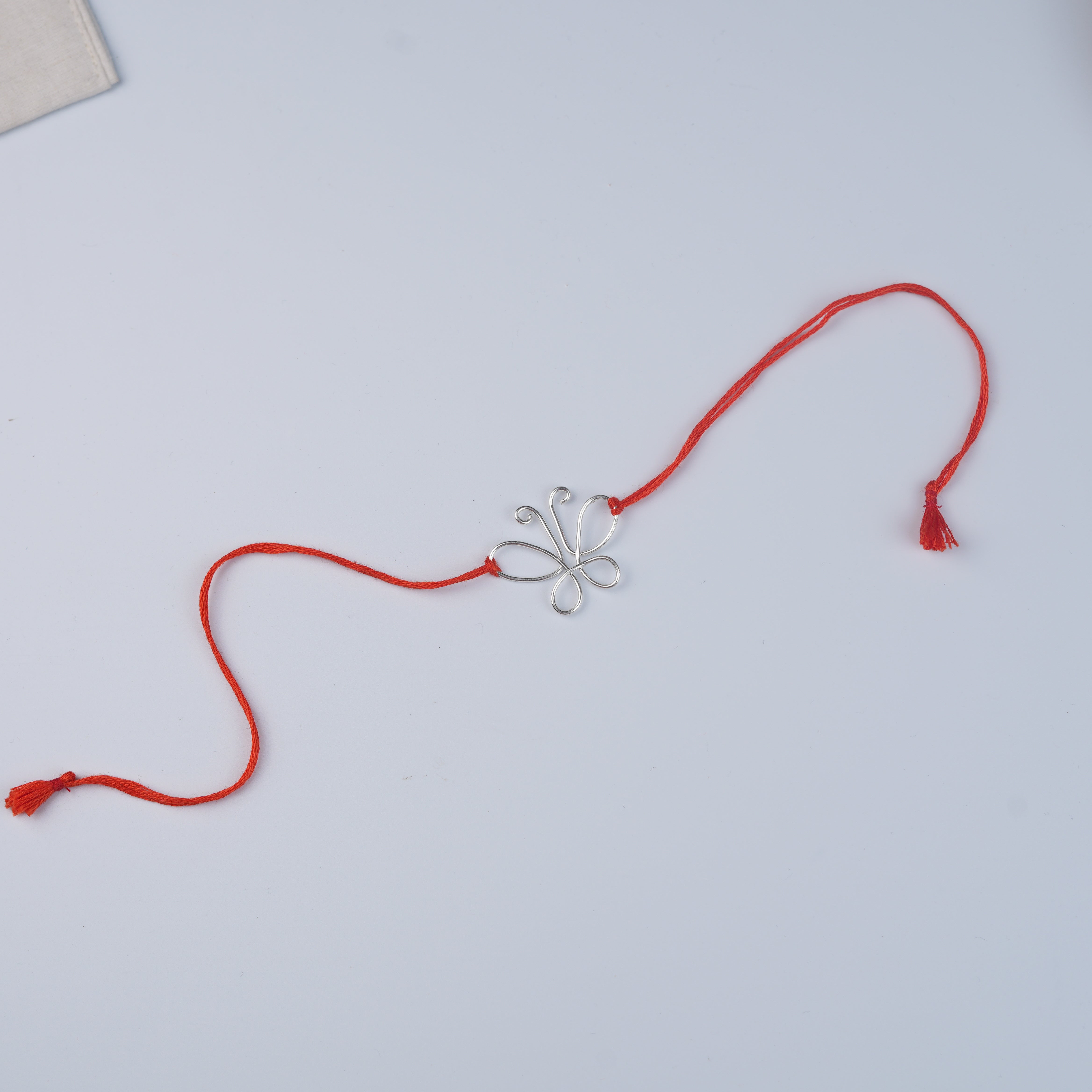 Silver Wire Bent Butterfly Rakhi (Project Handmade)