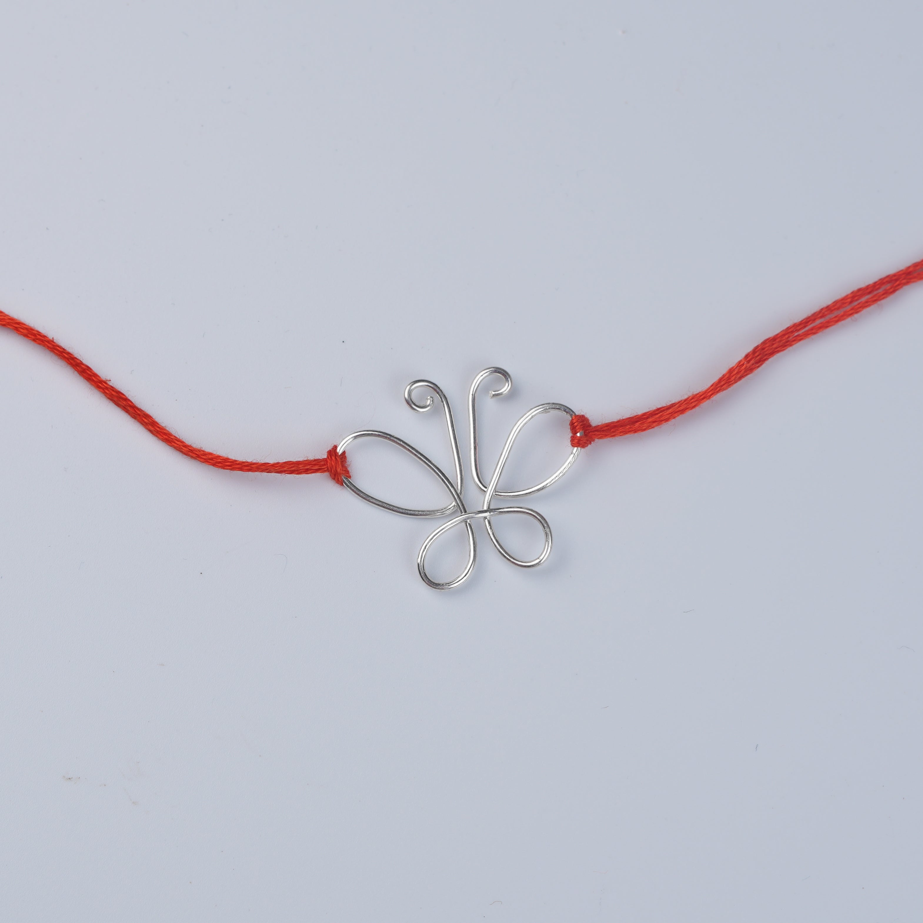 Silver Wire Bent Butterfly Rakhi (Project Handmade)