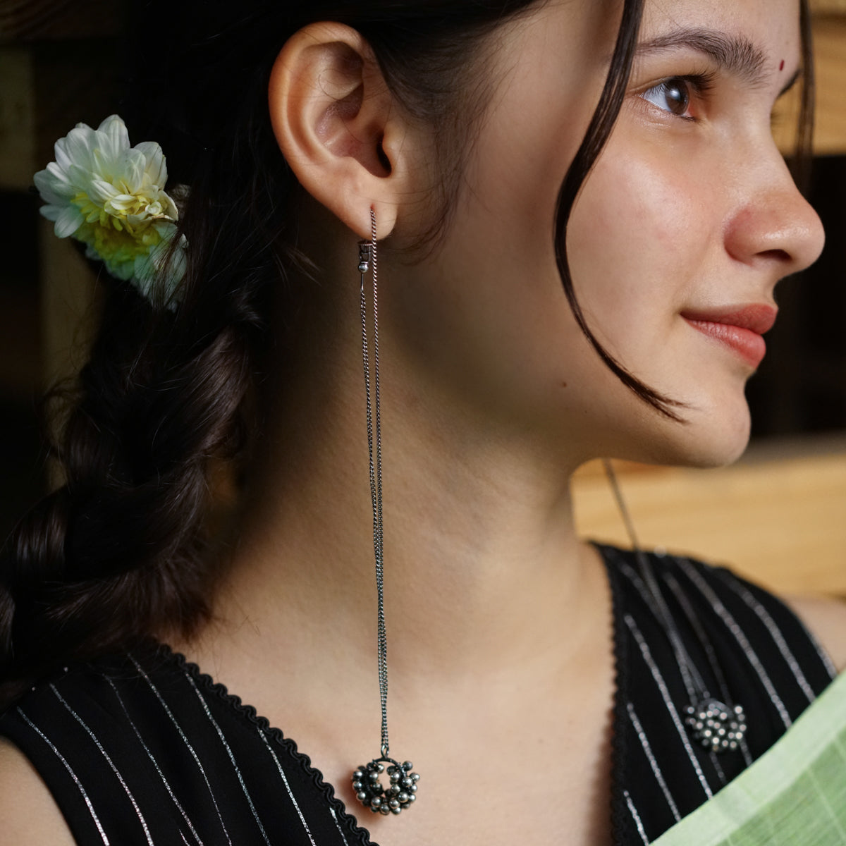 a woman with a flower in her hair