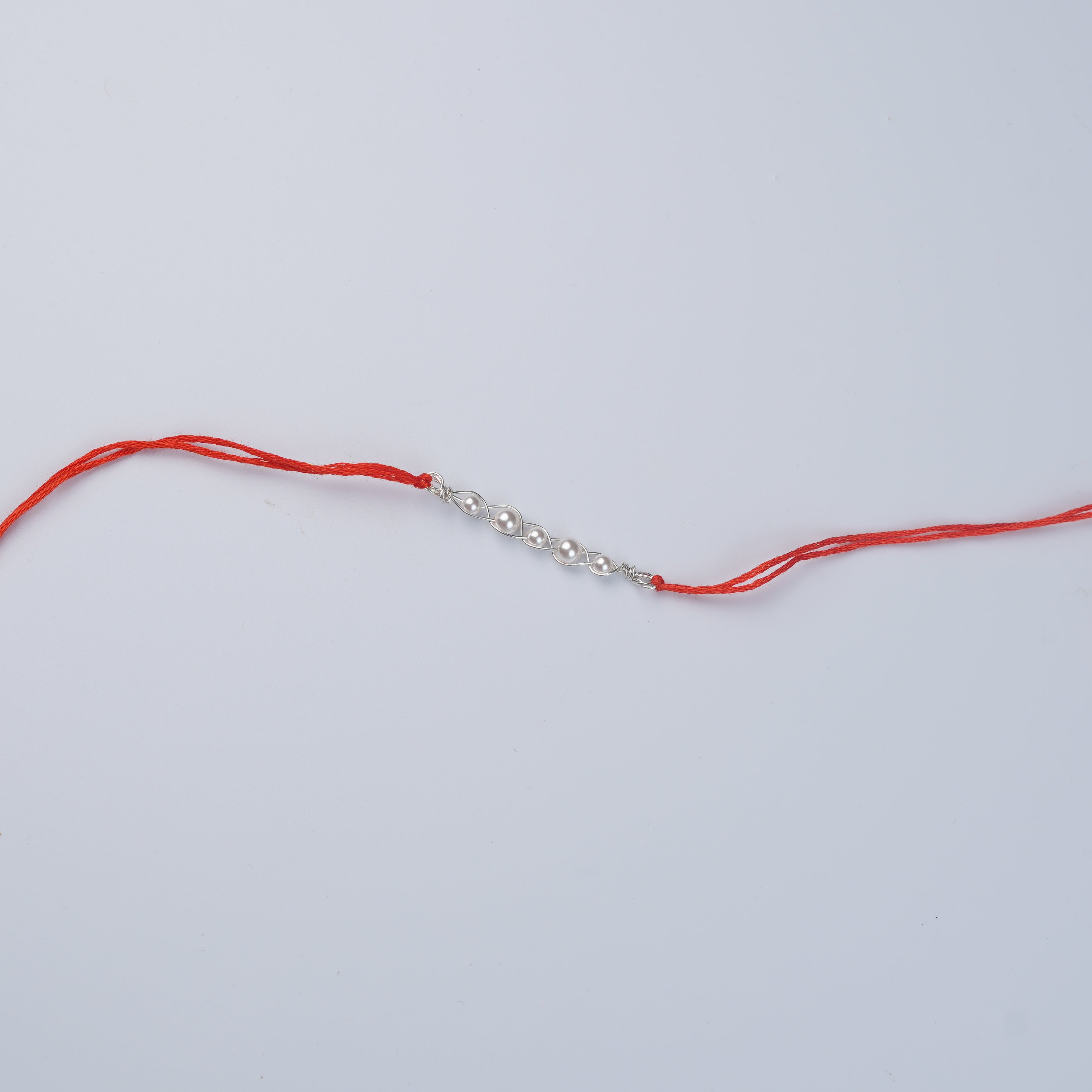 Pearl Wrapped Rakhi (Project Handmade)