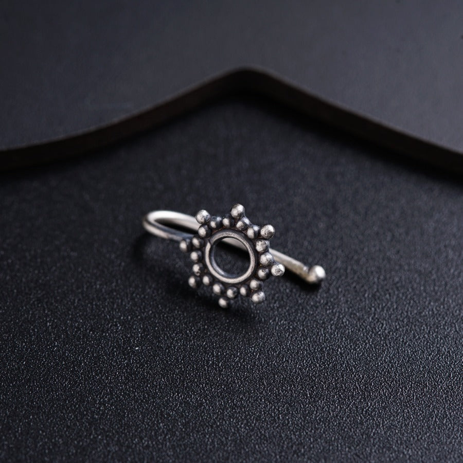 a close up of a ring on a black surface