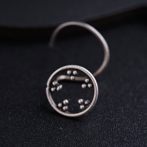 a close up of a ring on a black surface