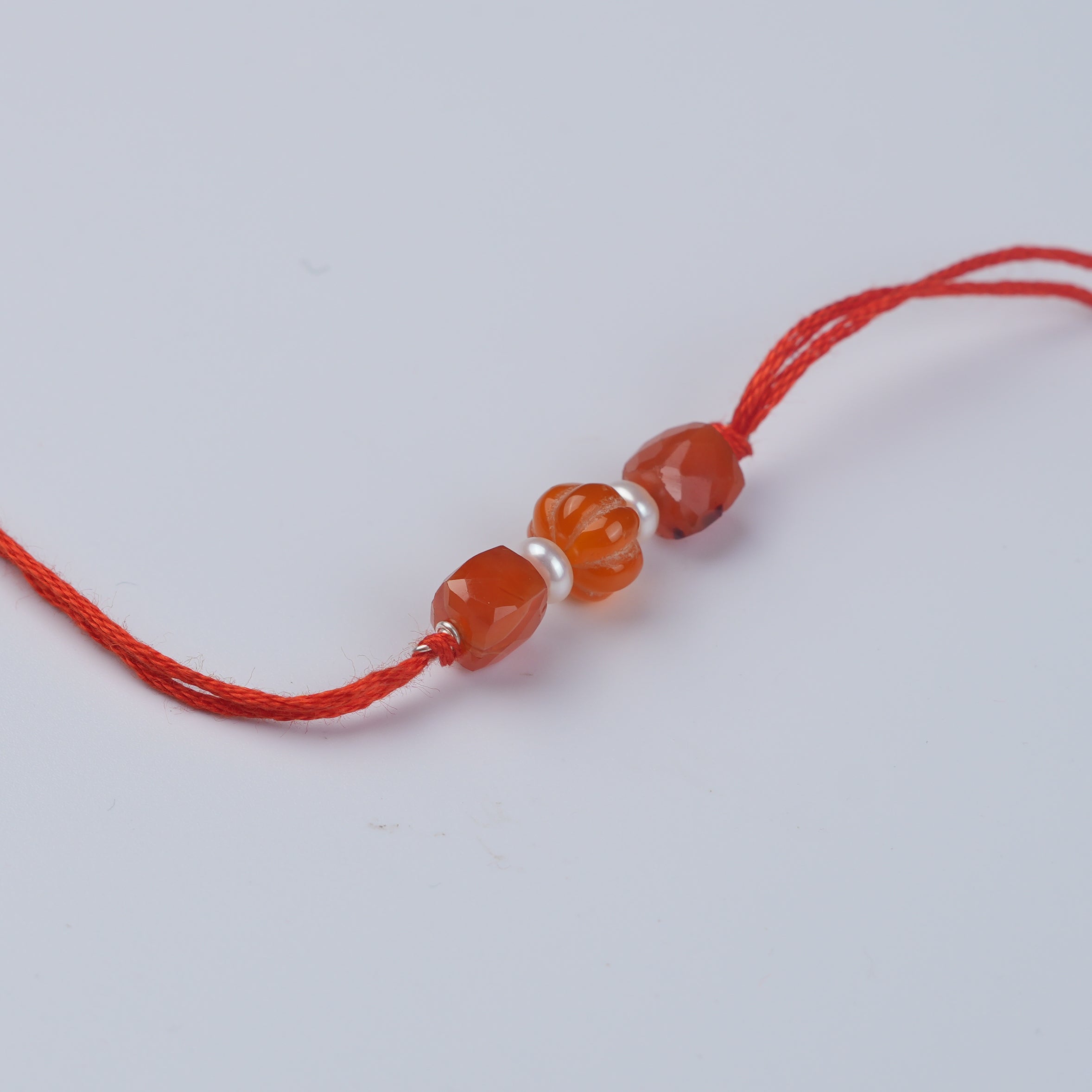 Carnelian & Freshwater Pearl Rakhi (Project Handmade)