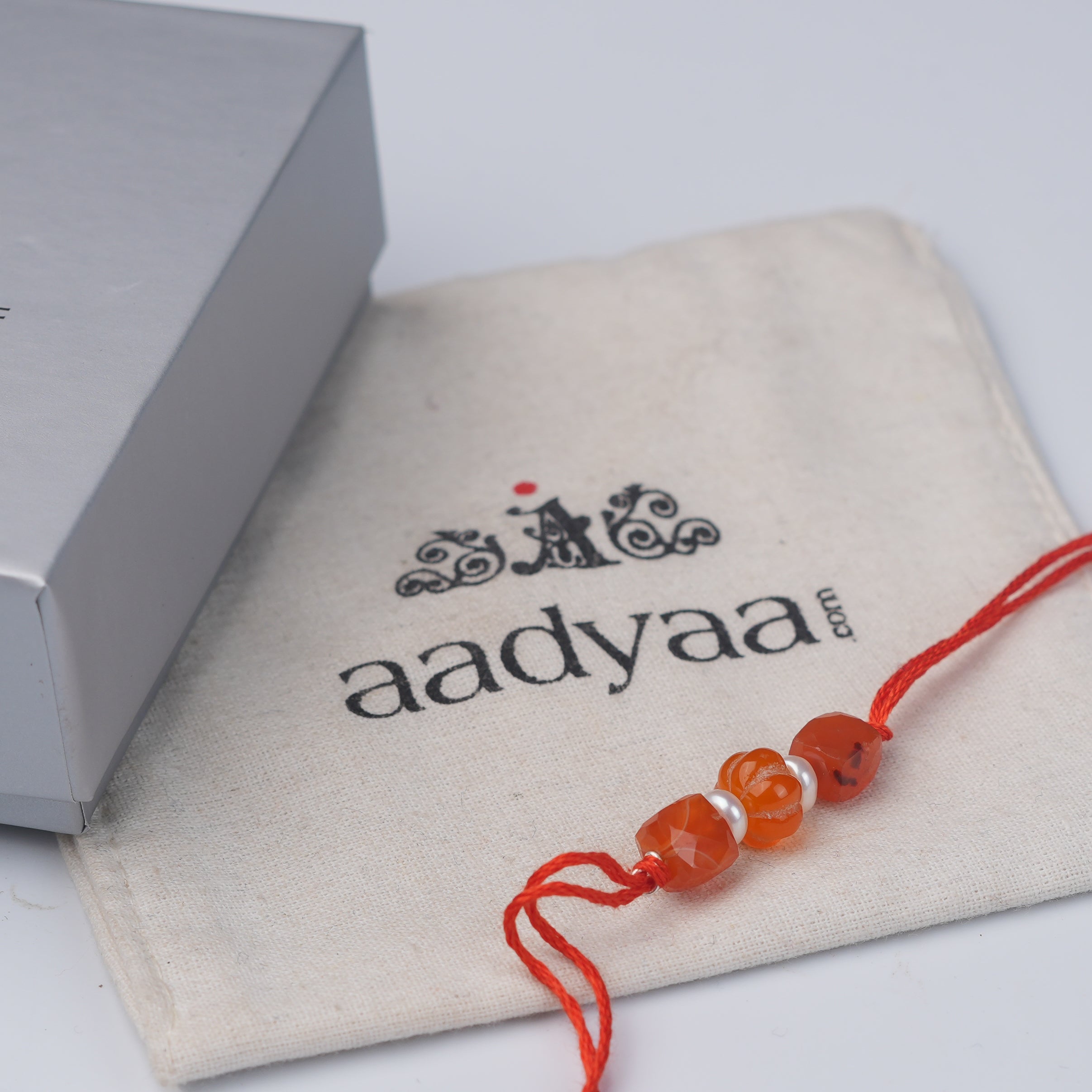 Carnelian & Freshwater Pearl Rakhi (Project Handmade)