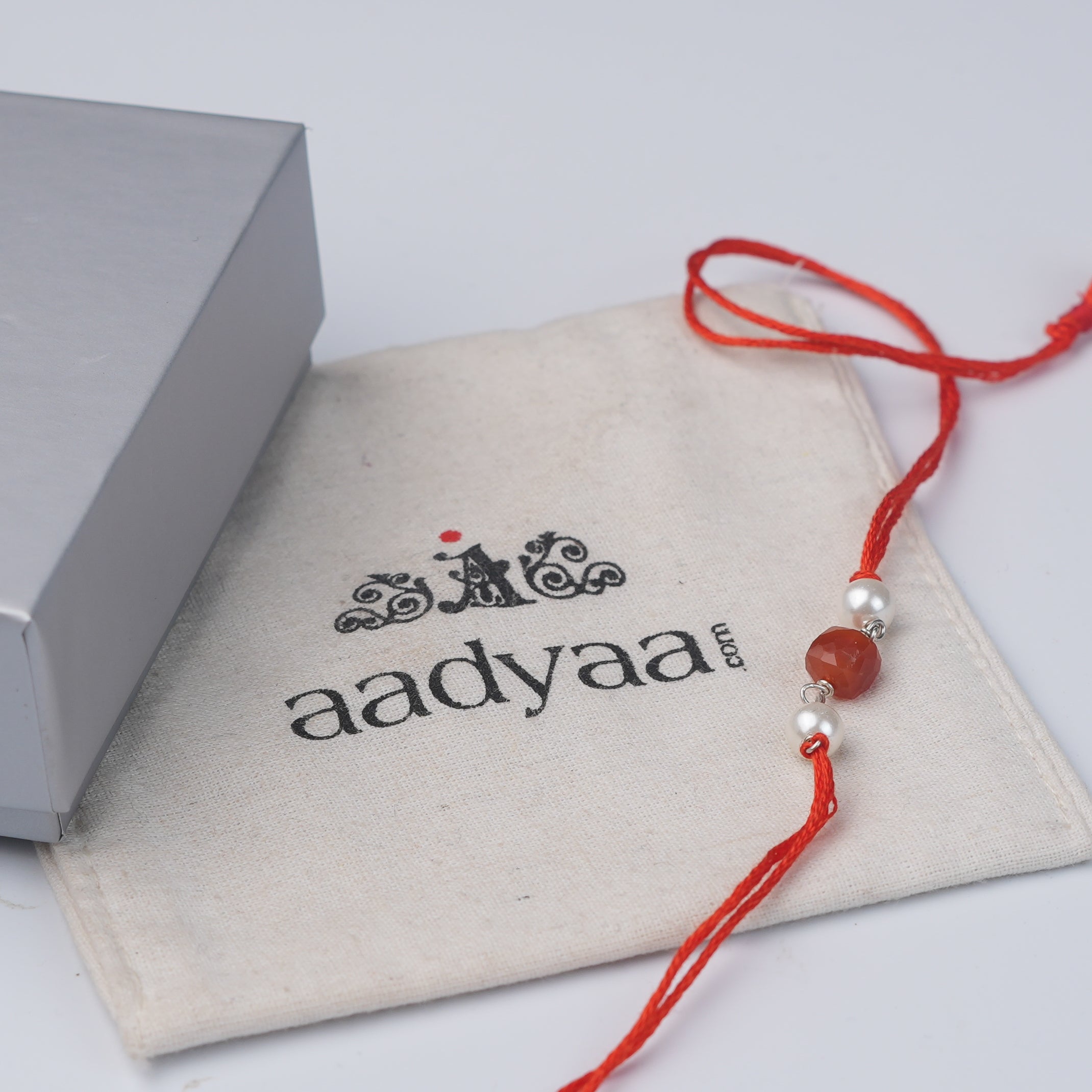 Carnelian & Pearl Rakhi (Project Handmade)