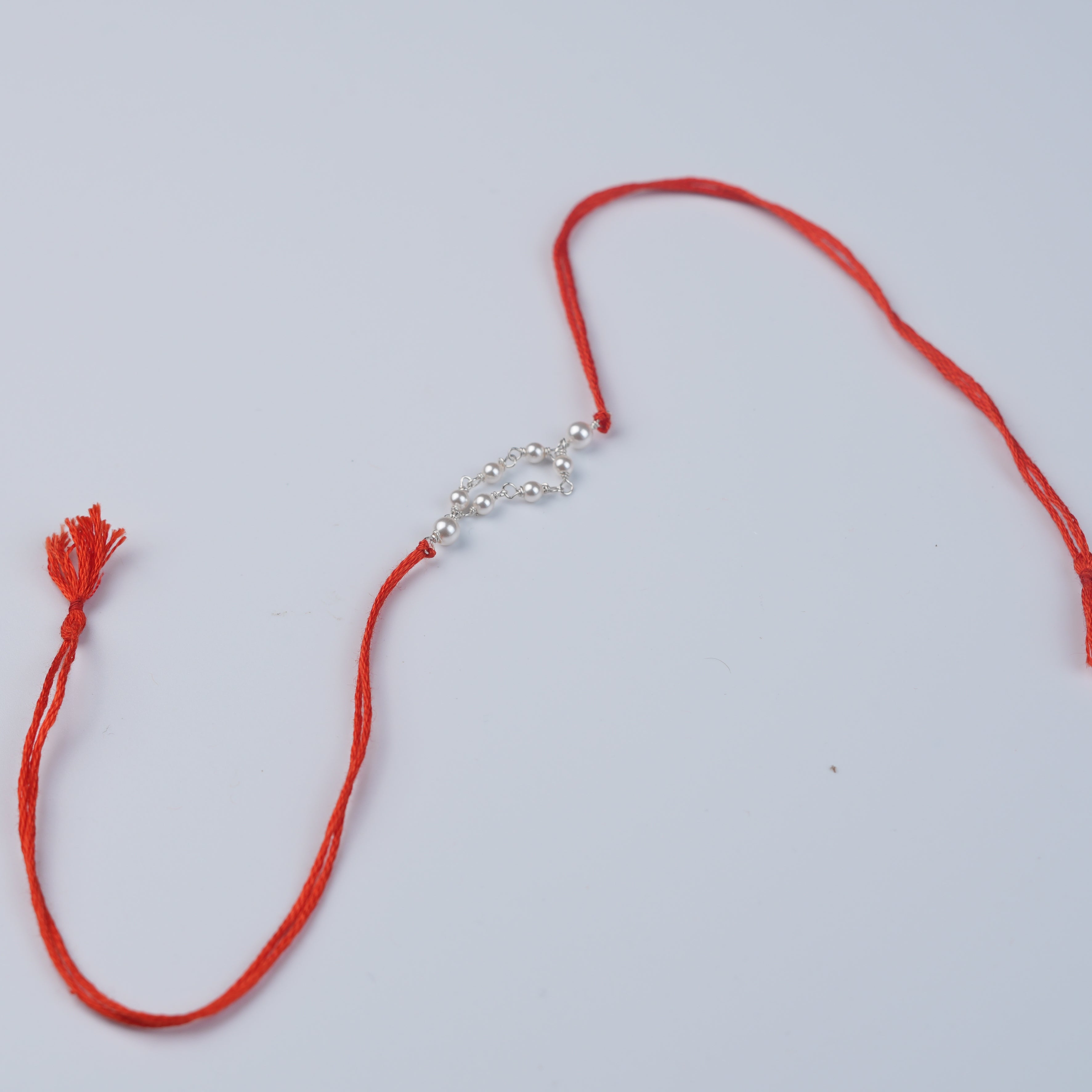 Pearl Ganthan Rakhi (Project Handmade)