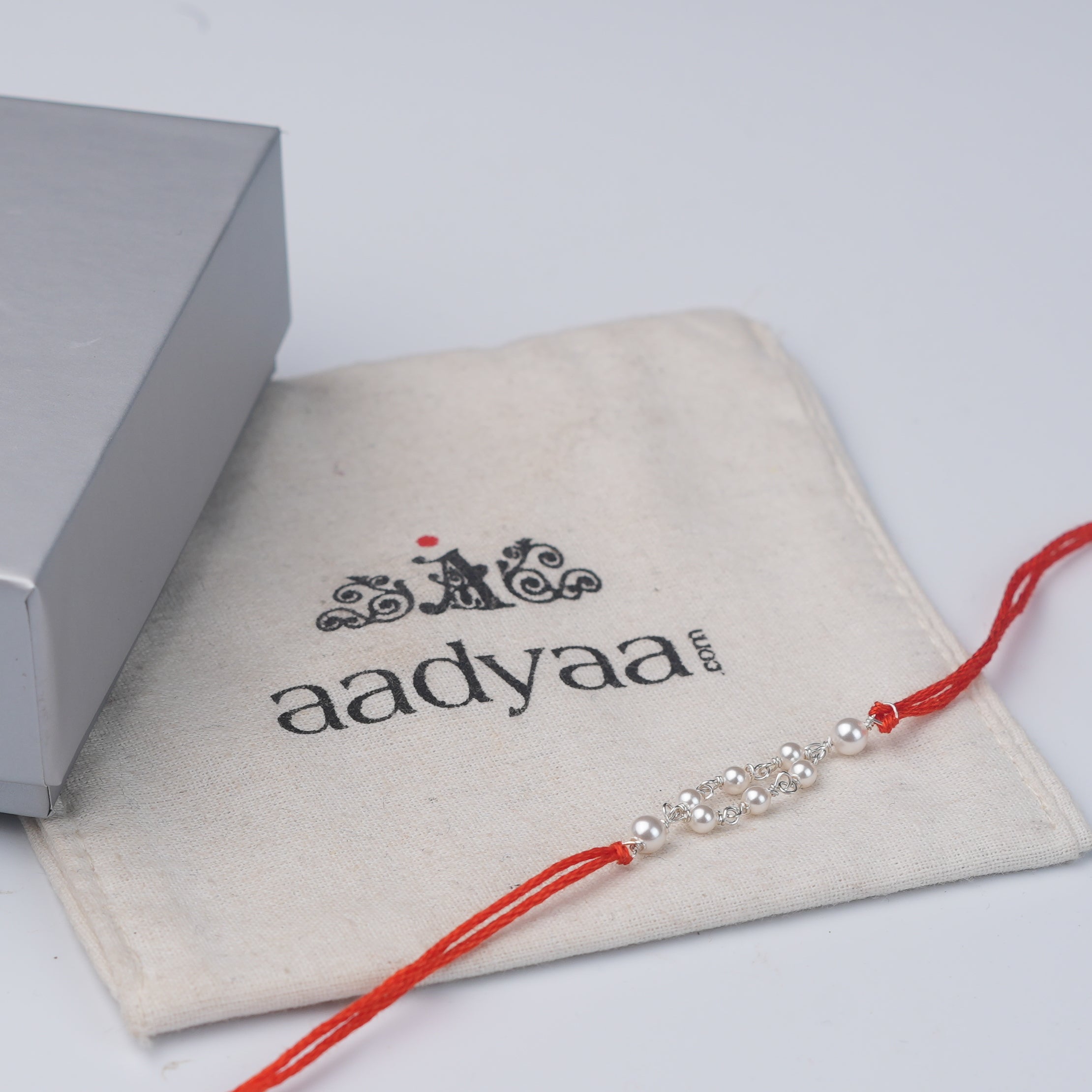 Pearl Ganthan Rakhi (Project Handmade)