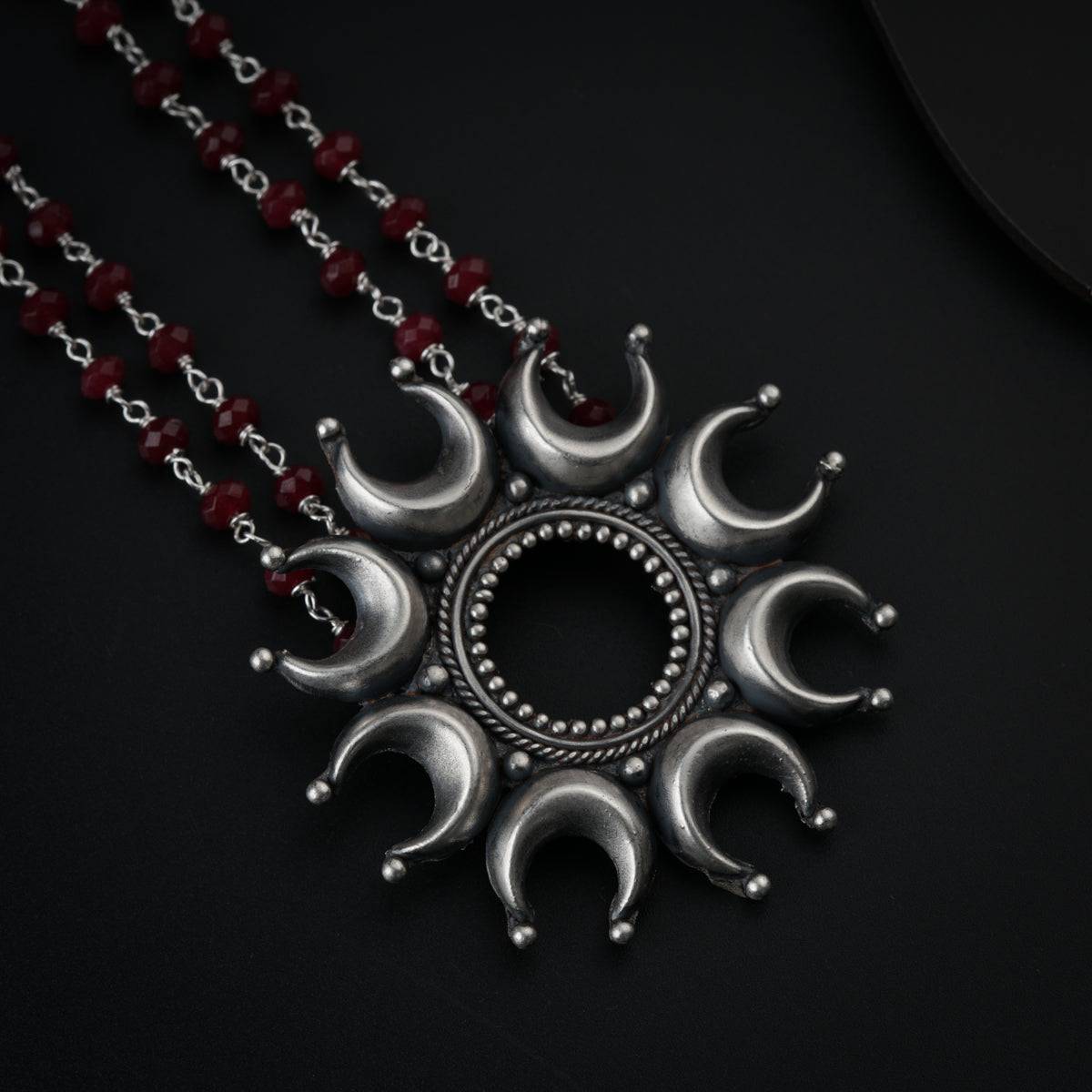 Silver Chandrakor Motif Set with Garnets