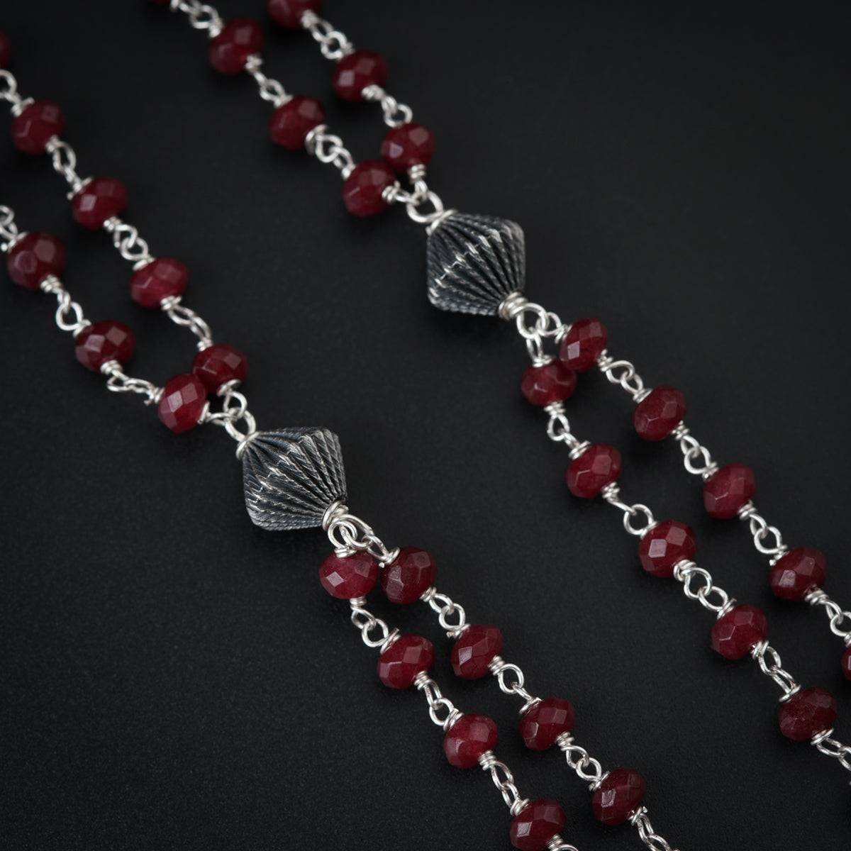 Silver Chandrakor Motif Set with Garnets