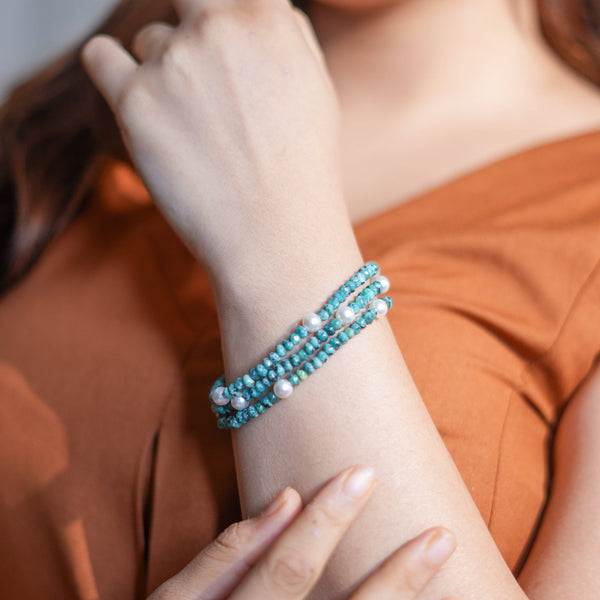 Model wearing Blue Jade & Pearl Silver Bracelet in 92.5 sterling silver for an elegant handcrafted jewellery look