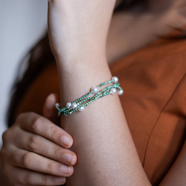Model wearing Micro Firoza & Pearl Silver Bracelet in 92.5 sterling silver for an elegant handcrafted jewellery look