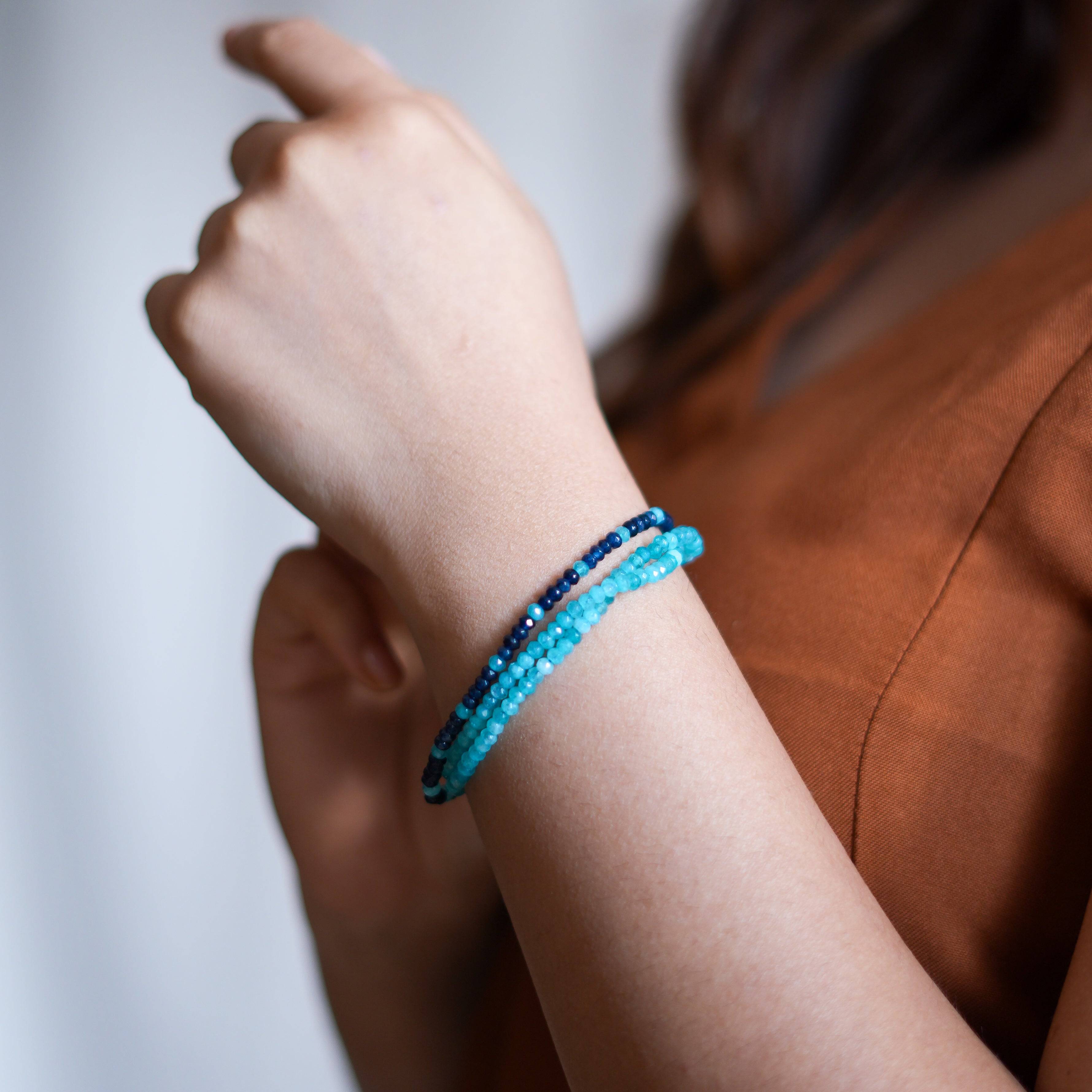 Model wearing a dark & Light Blue Jade Silver Bracelet in 92.5 sterling silver for an elegant handcrafted jewellery look
