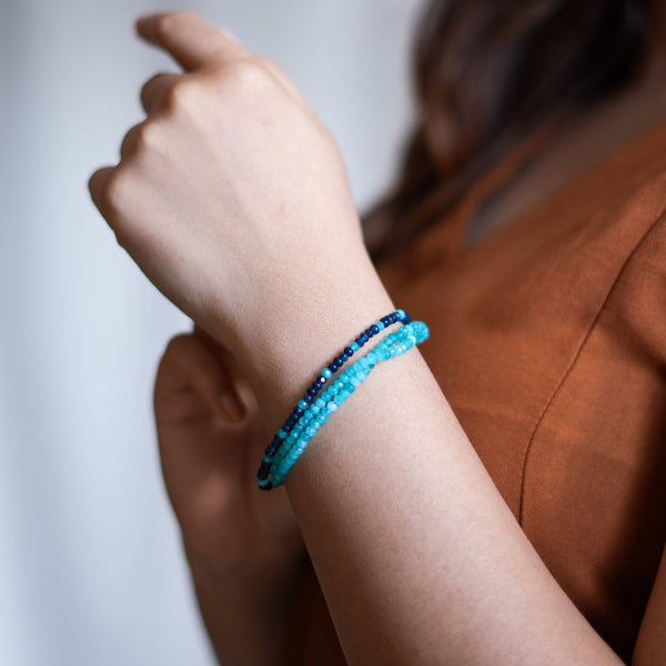 Model wearing a dark & Light Blue Jade Silver Bracelet in 92.5 sterling silver for an elegant handcrafted jewellery look