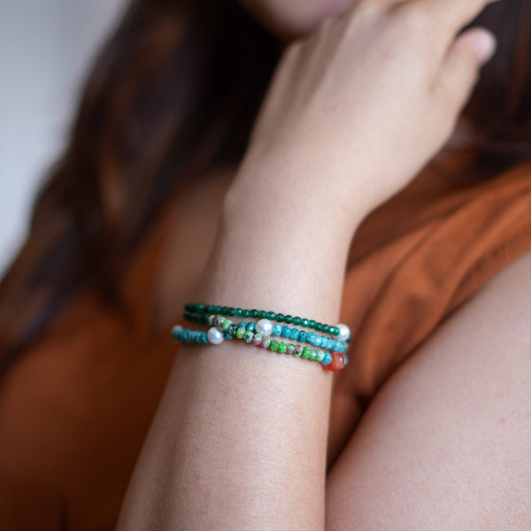 Model wearing Green Onyx, Pearl, Carnelian Cube, Green & Blue Jade Silver Bracelet for a vibrant handcrafted jewellery look