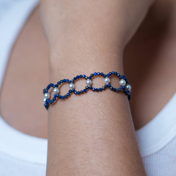 Model wearing Lapis Lazuli & Pearl Silver Bracelet in 92.5 sterling silver for an elegant handcrafted jewellery look