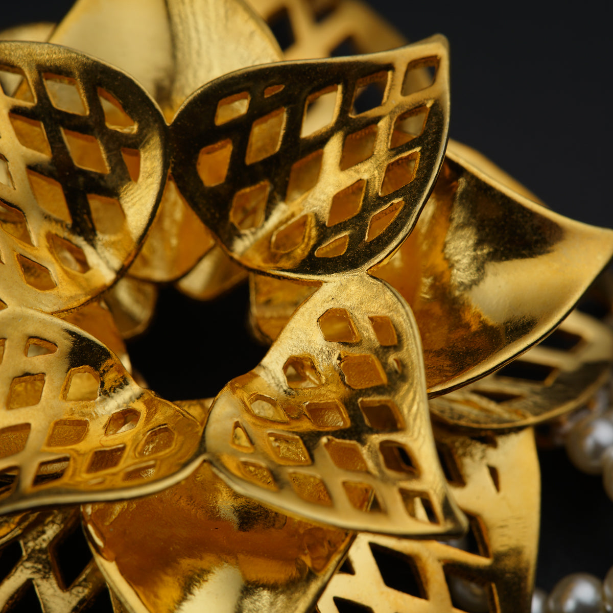 a close up of a gold decorative object