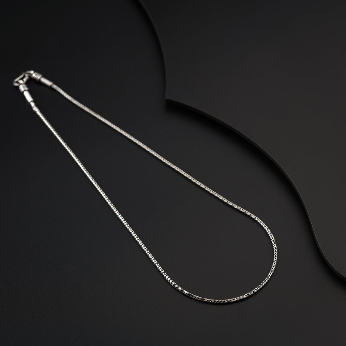 16-inch Silver Chain to demonstrate its fit and placement at the base of the neck.