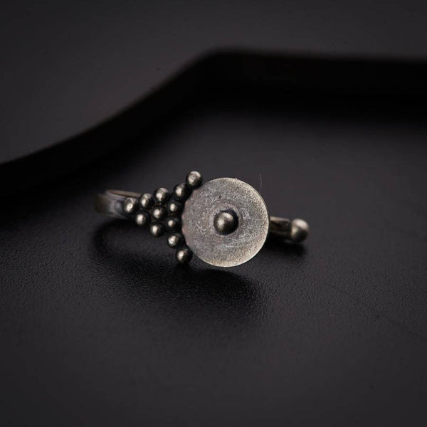 a close up of a ring on a black surface