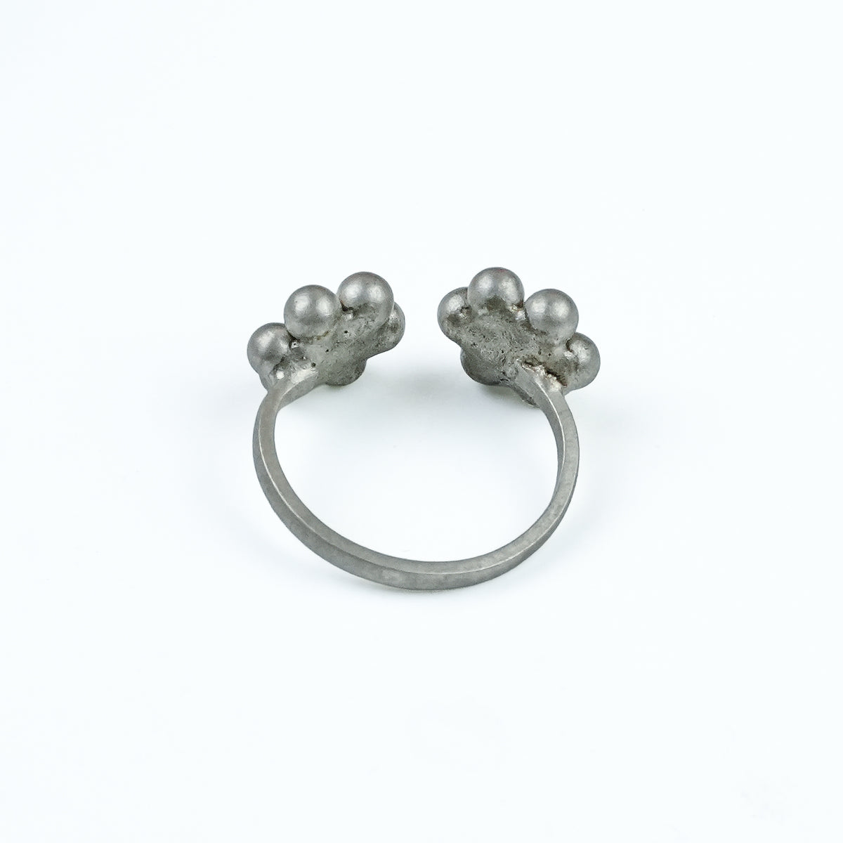 Angled view of Silver Oxidized Kudi Open Ring—Medium and Small Size Kudi highlights its open-ring structure, curved design, and distinctive oxidized finish.