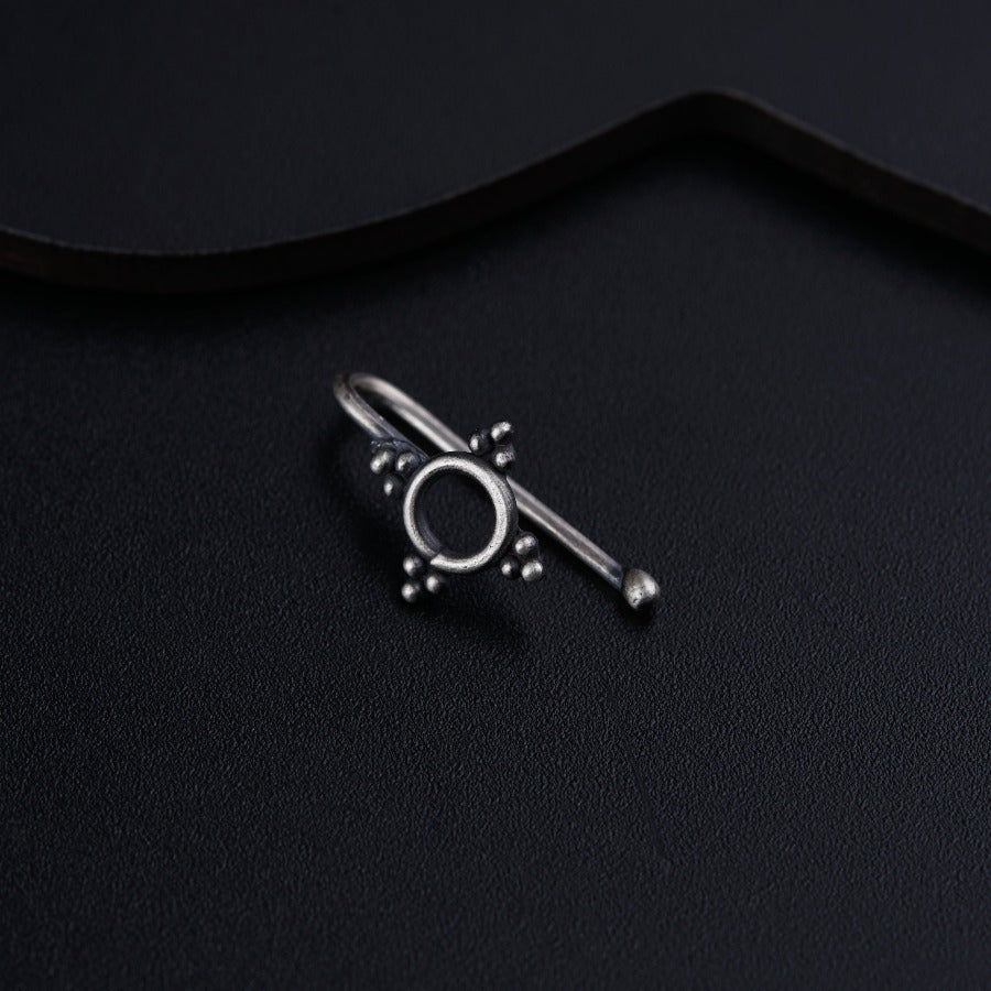 a pair of scissors sitting on top of a black surface