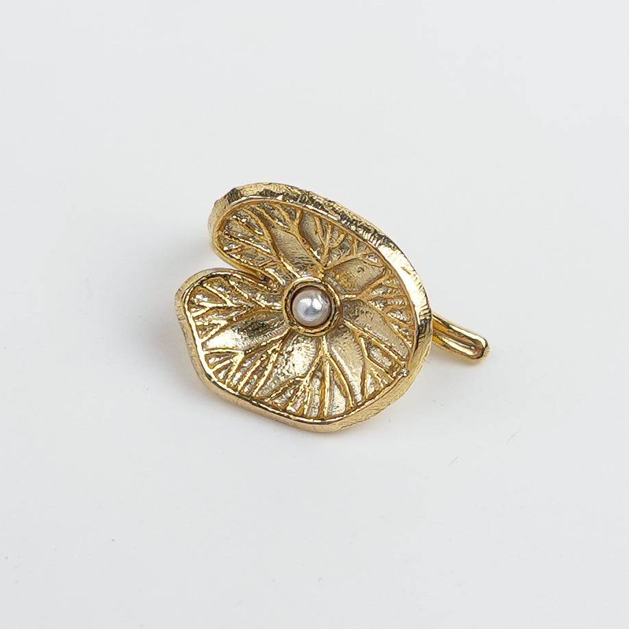 Flat-lay of Silver Saroj Parna Earcuff (Single) | 22K Gold-Plated with premium styling accessories and elegant presentation